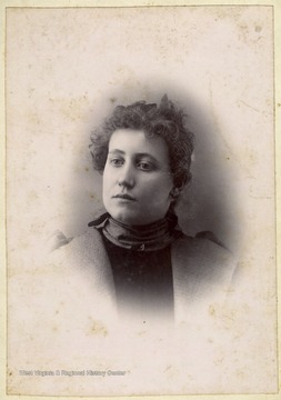 Cabinet card portrait of a young woman. Several of the Burchinal family are from Preston County, W. Va.