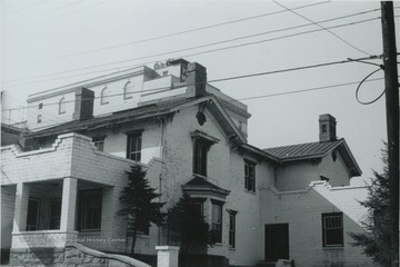 Located on 144 Pleasant Street, the original owner was E. M. Turner. The house is built in the Italianate style, ca. 1885. Information found on page 80 in "The Influences of Nineteenth Century Architectural Styles on Morgantown Homes" by Clyda Paire Petitte. It is Figure 56.