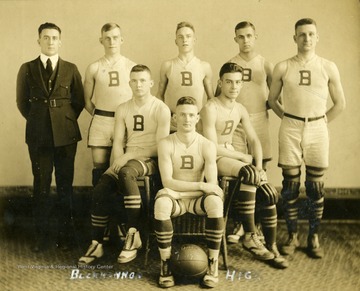 Team photo portrait of unidentified players and coach.