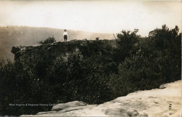 Unidentified person stands on the overlook rock.