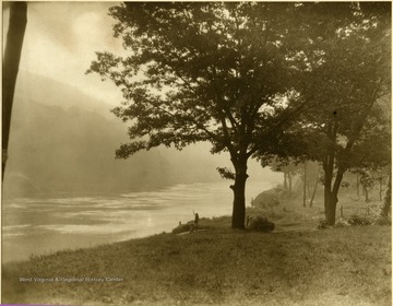 View of the river looking north. The two girls on the riverbank are not identified