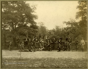 The First West Virginia Infantry was a National Guard unit stationed in Georgia during the Spanish and American War. The unidentified soldiers in this photograph pretend action to defend their position from an attack. 