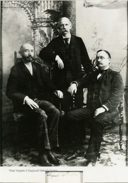 Standing - Congressman William L. Wilson from West Virginia; Seated, right-Congressman Clifton R. Breckinridge from Arkansas; Name of person seated left not readable.
