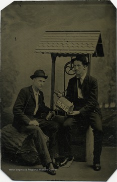 Frank Holme (right) from Preston County, West Virginia, was a nationally known artist and newspaper illustrator. In this staged photograph he pretends to share soup with an unidentified friend.