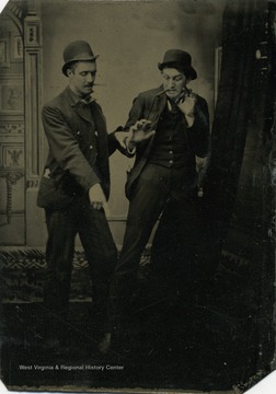 Frank Holme, right, from Terra Alta, West Virginia was a renown artist and newspaper illustrator. Here he poses with an unidentified friend in a staged photograph. 