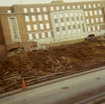 Initial stage of Beechurst PRT construction, building the foundation. Armstrong Hall in the background.