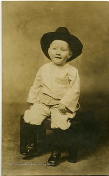 Postcard photograph of Cowboy toddler John Brando