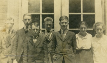 Postcard photograph, pictured: William McKin, Daniel Johnson, Russel Westfall, Kemitt Burton, Harry Scott, Helen Newman, and Alta Talkington