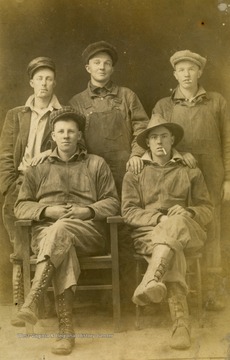 Pictured: Top middle: Troy Riggs; Front Left: Guy Ball, other men not identified.