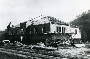 Transcribed on back of photo "Red brick school house built circa 1914-1916 Blacksville, West Virginia. This building housed the grade school and Blacksville High School".