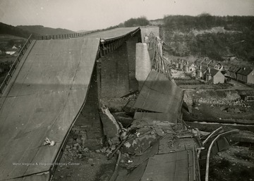 Information on back of photo reads: "This bridge, part of the German autobahn highway near Kaiserslautern, was blown up by fleeing Nazi troops during the advance of American forces inside the Saar bulge. Kaiserslautern, road junction town in the area, was entered by the Third U.S. Army troops March 20, 1945. The autobahn is the many-laned concrete highway designed to link up most of Germany in a network. The system had not been entirely completed by the Nazis at the outbreak of the war."