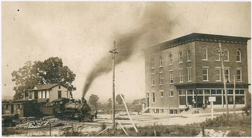 A Morgantown and Kingwood Railroad train rolls pass the station located near what is now Route 7.