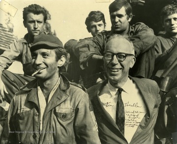 Ken Hechler, author of the book "The Bridge at Remagen" on set for the same titled movie with Ben Gazzara and other actors in 1968 in Davle, Czechoslovakia. Hechler served as a combat historian in the European Theater of Operations during World War II and was attached to the 9th Armored Division when one of its infantry-tank task forces captured the Ludendorff Bridge spanning the Rhine river at Remagen, Germany. Ken Hechler served as technical adviser for the film adaptation which premiered in 1969. Ken Hechler pictured in the front right with Ben Gazzara to his left.