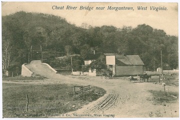 Postcard photograph of a dirt paved road to the bridge over Cheat River. A house and a structure with a storefront fascade is situation at the near side of the bridge. Also inscribed on the image, "Published by Dawson and Co. Morgantown, West Virginia".