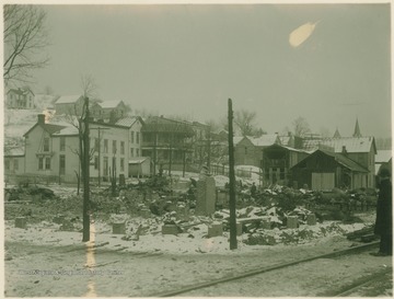 Fire destroyed the buildings in December, 1901. Furbee House is seen on the left and the Mountain State House on the right, in the background.