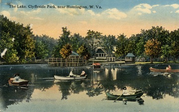 Several people canoeing out on the lake during this fall day at Clyffside Park in Huntington, West Virginia. Published by I. Robbins &amp; Son. (From postcard collection legacy system.)