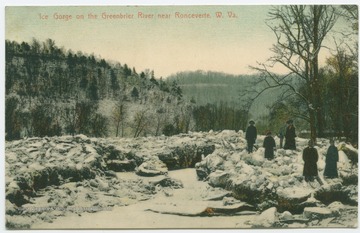 Unidentified people standing along the ice covered, rocky bank of a frozen river in North Caldwell, W. Va. Published by Wharton Brothers. (From postcard collection legacy system.)