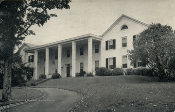 An outside, frontal view of the General Lewis Inn, an old-fashioned and historic hotel. Published by The Stone Printing &amp; Mfg. Co. See original for correspondence. (From postcard collection legacy system.)
