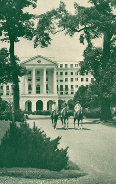 Three riders on horseback in front of the Greenbrier Hotel. (From postcard collection legacy system.)
