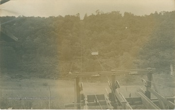 "Photograph of cable line and car taken from second-story window of packing house." (From postcard collection legacy system.)