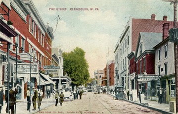 Pike Street filled with people going about their business. Pike News Co. building on the left. Model Liquor Store further down the road on left. Clarksburg News building on the right. See original for correspondence. Published by Pike News Company. (From postcard collection legacy system.)