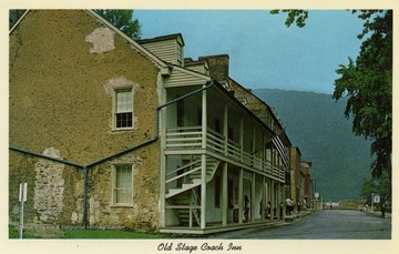 Caption on back of postcard reads: "This beautiful old building was built in 1826. Used as a store first, it was later remodeled into an inn serving stagecoach trade and travelers on the C &amp; O Canal and B &amp; O Railroad. Since restored, it now serves as a Park Service Office and Tourist Center, at Harpers Ferry, West Virginia." (From postcard collection legacy system.)