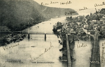From this view you can see such things as the Shenandoah River, Loudoun Heights, Virginia, a Baltimore and Ohio Railroad Bridge, as well as a paper mill and hotel in the town of Harpers Ferry.(From postcard collection legacy system.)