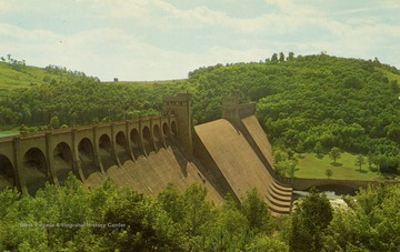 Caption on back of postcard reads: "Completed in 1938 by U.S. Corps of Army Engineers. This dam is the largest East of the Mississippi River. It is 230 feet high and 1,921 feet in length." Published by Ellen Jane Wiseman. (From postcard collection legacy system.)
