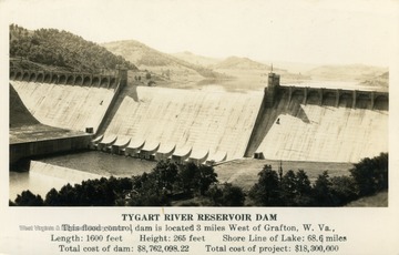 Caption on postcard reads: "This flood control dam is located 3 miles west of Grafton, W. Va. Length: 1,600 feet. Height: 265 feet. Shore Line of Lake: 68.6 miles. Total cost of dam: $8,762,098.22. Total Cost of project: $18,300,000." (From postcard collection legacy system.)