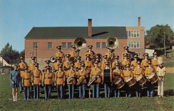 Caption on back of postcard reads: "Thomas Public School Band, a prize winning 36 piece band with equipment and uniforms purchased by a public spirited community of music loving people." published by Naturecraft. (From postcard collection legacy system.)