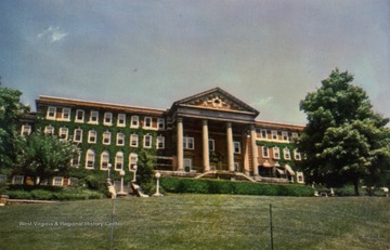 Now known as Stalnaker Hall. Caption on back of postcard reads: "Women's Hall has three wings and houses more than 250 students, mostly upperclasswomen. Residents have a fine view of the main University campus." Published by Cincinnati Litho Company. (From postcard collection legacy system--WVU.)