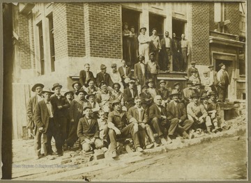 A group photo taken in front of the WVU building still under construction.