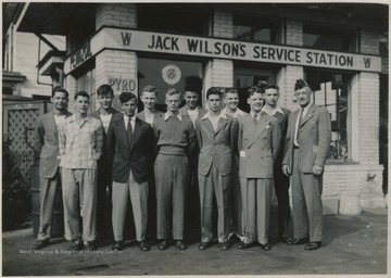 Group of boys standing in front of Jack Wilson's Service Station. 