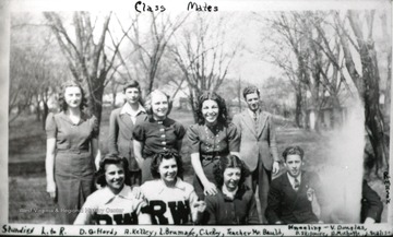 Standing from left to right: D. Giffords, A. Kelley, L. Brumahe, C. LeRoy, and their teacher Mr. Bauld. Kneeling from left to right: V. Douglas, D. Skidmore, H. Michotte, and J. Sealise.