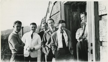 Photo identifies the men as "Max Cubbon, Snead, Russ Thompson, Arbon Lang, Harry Bartells, Mr. Gaines, Lawerence Hayes." The identified boys are waiters at  what is now know as West Virginia University's Stalnaker Hall. 