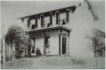The home, located on the corner of Fayette &amp; Chestnut Streets, was built in 1833 as Monongalia Academy for Females. It was rebuilt in 1852 and 1858, then sold in 1869. The building was purchased in 1992 by Grandfather Henry S. Hayes, then sold again in 1924 to C &amp; P Telephone Co. Pictures on the porch is Grandmother Ann Rebecca Hayes and Anna Johnson (Camisa).
