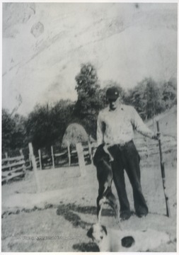 Basil Ayers pictured on his land with his dogs. 