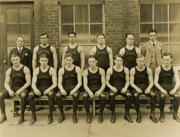 Standing, from left to right: Coach Steve Harrick, Martin, Lewis, Levine, Higgins, and Manager Browning. Seated, from left to right: Meyers, Captain Brill, Henry, Higginbotham, Wotring, Johnson, Beatty. Print number 256.