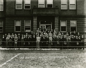 Print number 394. 8th annual Water Conference group photo in front of Mechanical Hall.