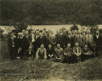 A group of unidentified men pose by New River.