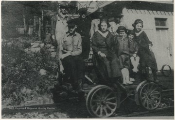 Four unidentified men pictured on the motor care with Rose and Mary Mullens as well as Raymond and George Miller. Photo courtesy of George C. Miller.