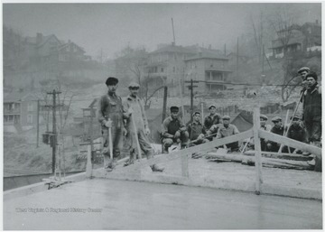 Workers pose on the site.