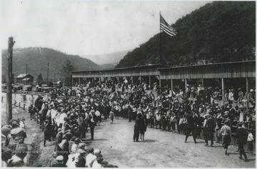 A large crowd fills the grounds.