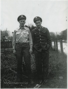 Raymond is on the left. Dewey is on the right. The two are pictured in their uniforms.