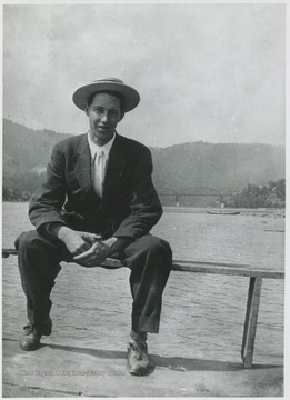 George Hoover pictured on the ferry's rail traveling across New River.