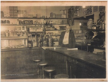 Neely pictured inside the building which was first the Avis Ashland Station and then a Cleaner's. The tavern is at the foot of Avis Overhead Bridge. 