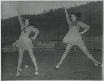 Peggy Waddel (left) and Wilma Shirey (right) are pictured at the Avis Football Field, later known as Stokes Stadium. 