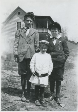 The three boys are pictured outside of a house. Last names unknown.