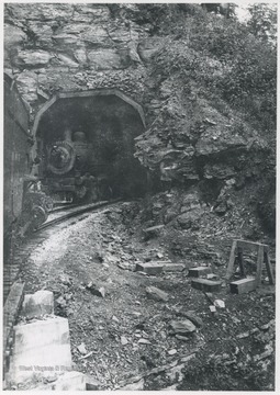 A train coming through the tunnel.