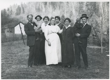 Pictured from left to right: R. A. Keller and granchild Eloise, Kate (Keller) Hall, Mary Luella (Wright) Keller, Nellie Ruth (Hoover) Keller, Nina (Roach) Keller, Claude Keller and child.
